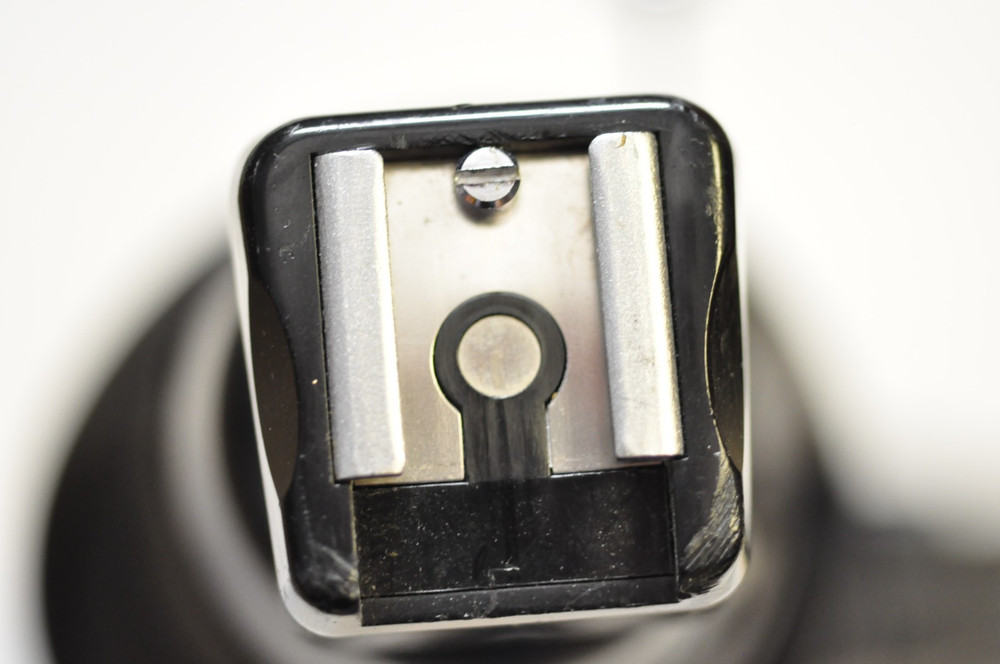 Sunpak deluxe flash / accessory / grip bracket with their cable release.