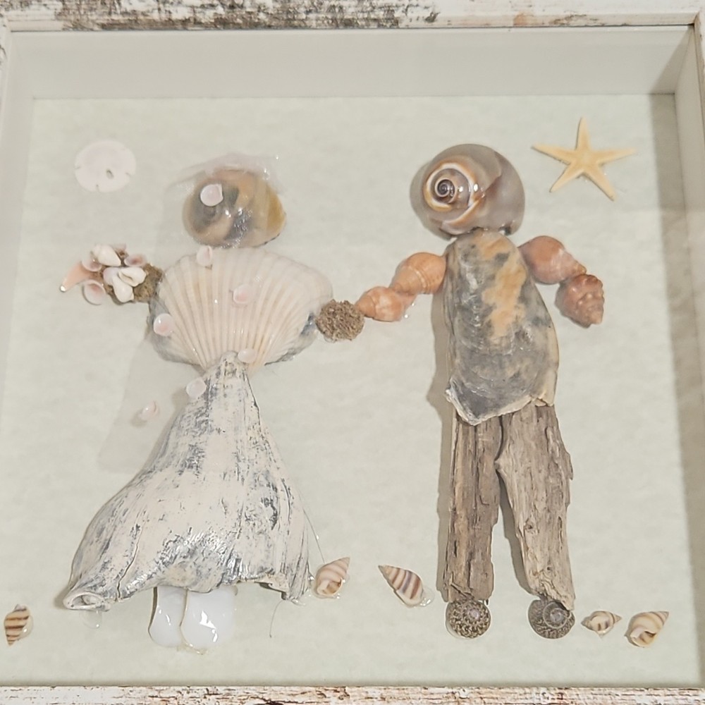 Unique seashell wedding couple art piece.