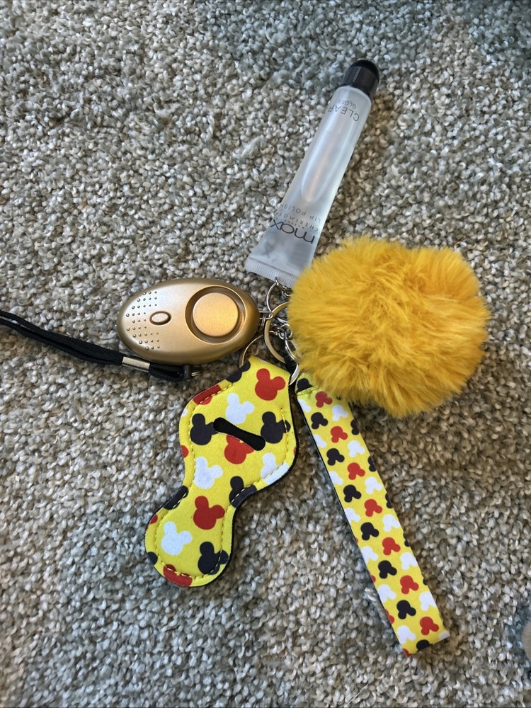 personal safety keychain set with several attached accessories.