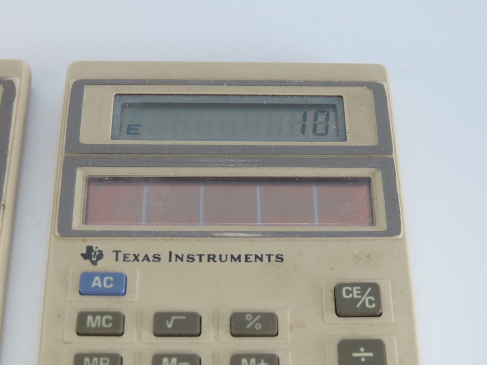 Lot of 2 Texas Instruments TI-1006 Light Powered Calculators Working