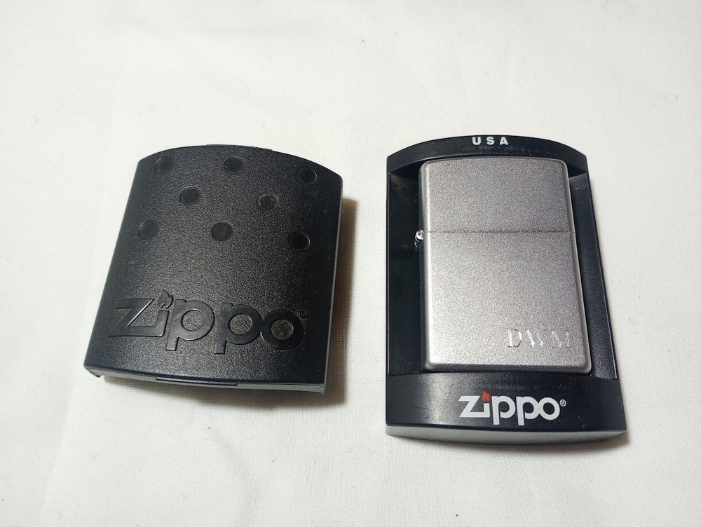 ---New unfired 2005 Zippo DWM monogram engraved lighter