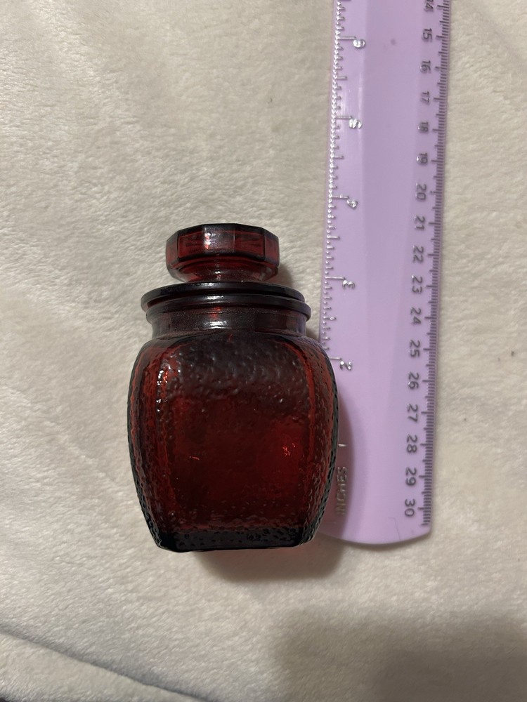 Vintage ruby red apothecary jar With A Textured Finish And Lid With Star Pattern
