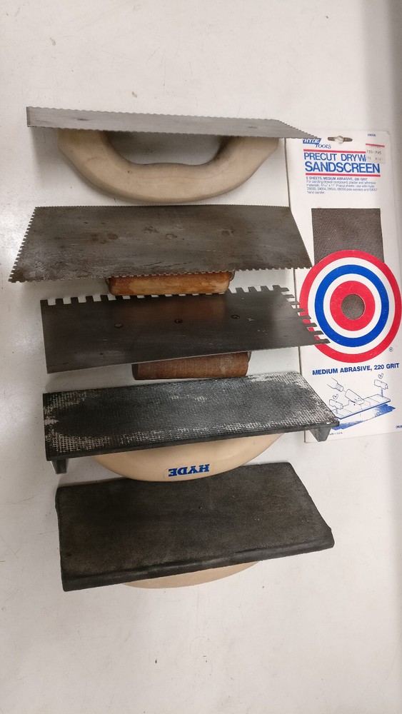 Eight assorted drywall/mud tools