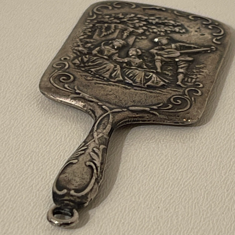 Small cast metal vintage vanity mirror
