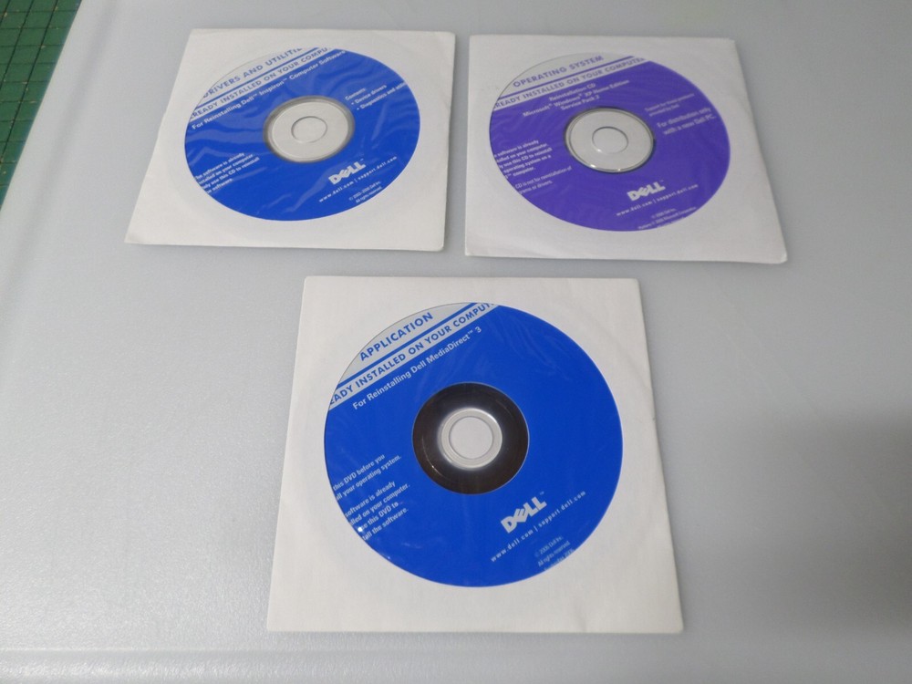 LOT OF 3 - 2006 DELL OPERATING SYSTEM / APPLICATION / DRIVERS & UTILITIES DISCS