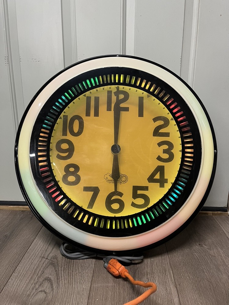 Vintage Chasing Rainbows Neon Spinner Clock