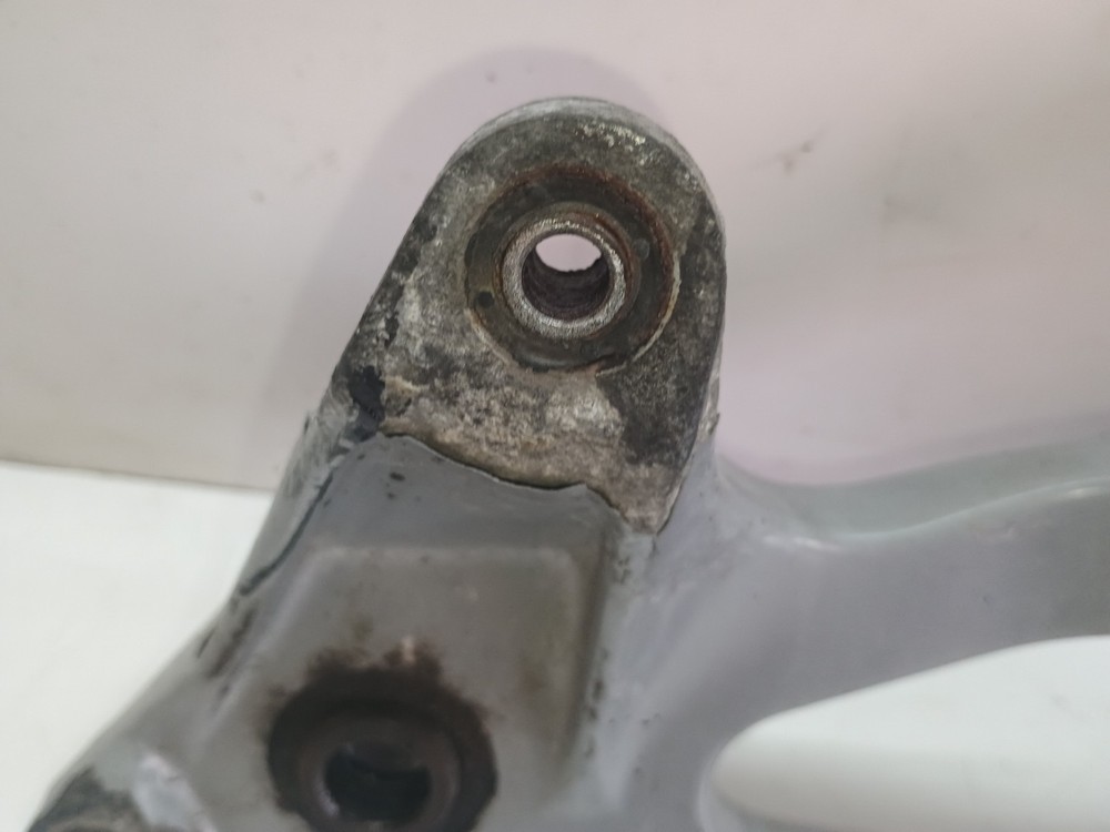 Honda Dylan SES 125cc 2003 Rear wheel and exhaust support bracket