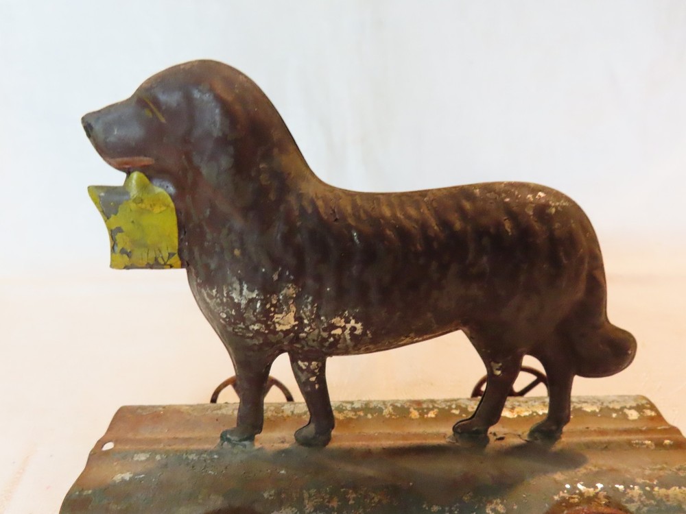 Antique tin dog pull toy