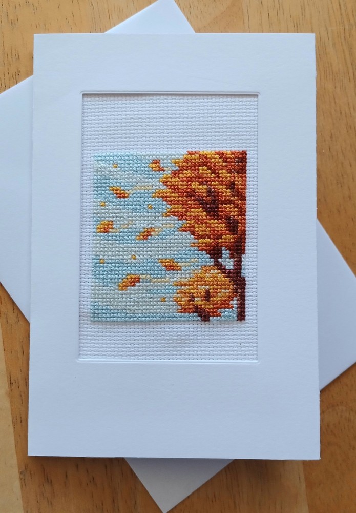 Fall Tree leaf breeze. Finished X-stitch. White card, blank insert & envelope.