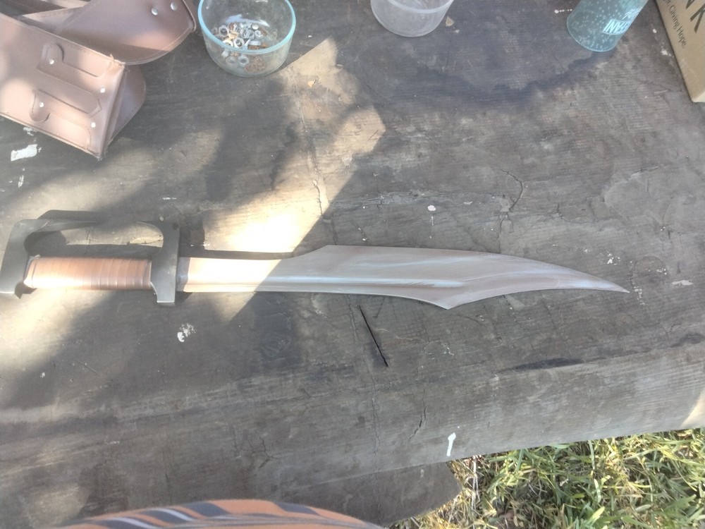Unsharpened sword with carrying sheath and adjustable shoulder strap