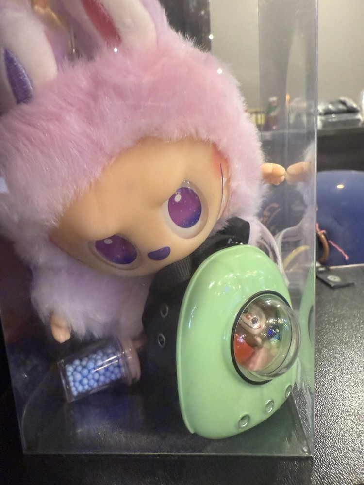 Labubu backpack and a mini figure inside
