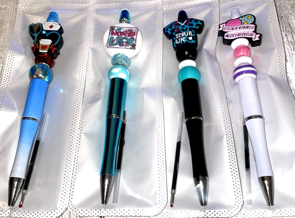 4 miscellaneous beaded pens with 1 ink refill each