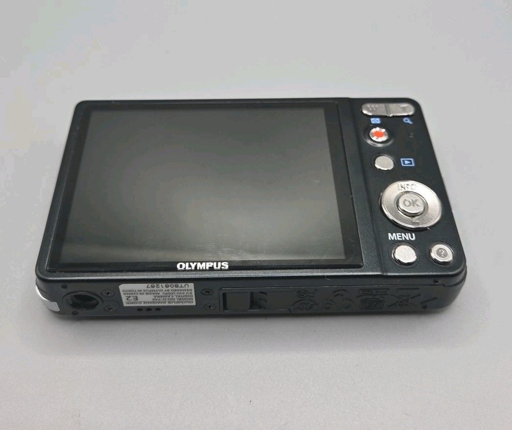 Olympus D-745 Digital Camera And Charging Lead, Black.
