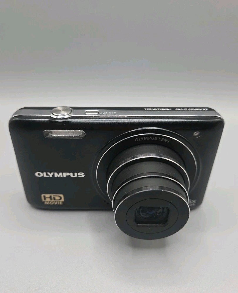 Olympus D-745 Digital Camera And Charging Lead, Black.