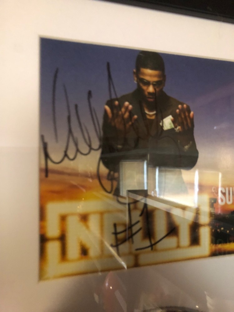 Autographed Nelly CD Display