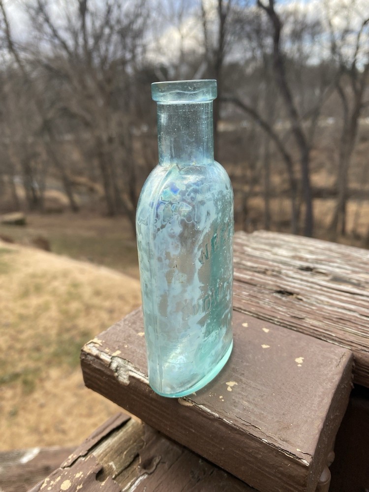 Week’s Snow Flake Blue Antique Bottle