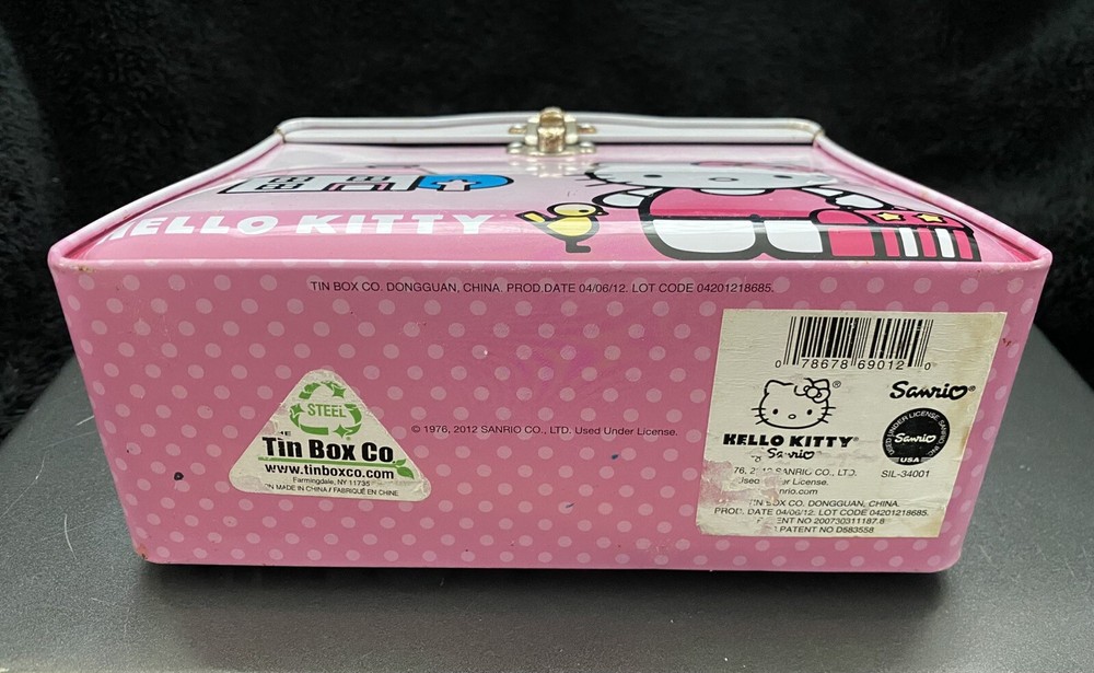 1976, 2012 Sanrio Hello Kitty Tin Box Co. Lunchbox w/ Beaded Handle.