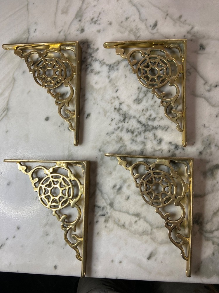 Vintage brass shelf brackets; four