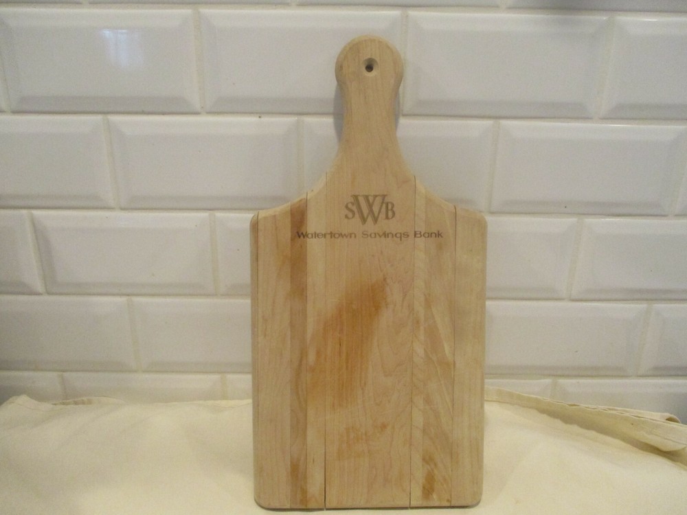 Watertown Savings Bank Cutting board with handle.