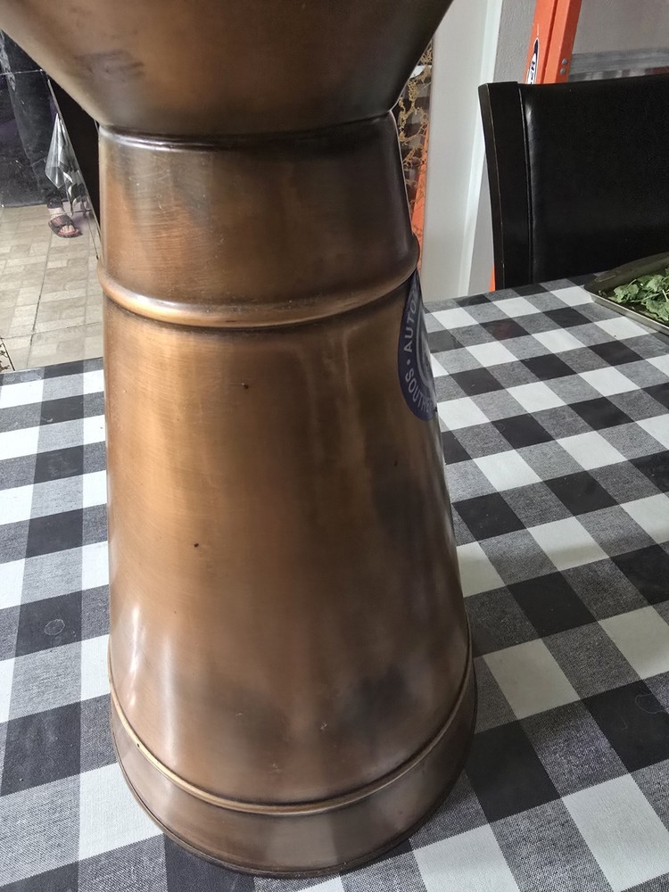 A masterpiece. An antique copper vase.