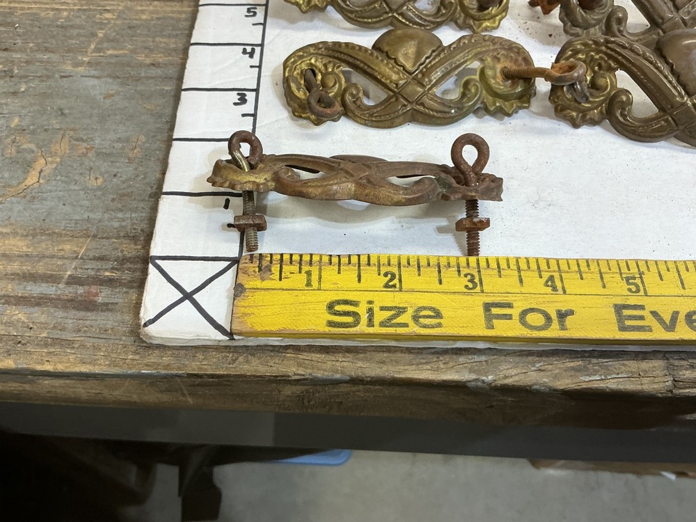 7 VINTAGE STAMPED BRASS DRAWER PULLS