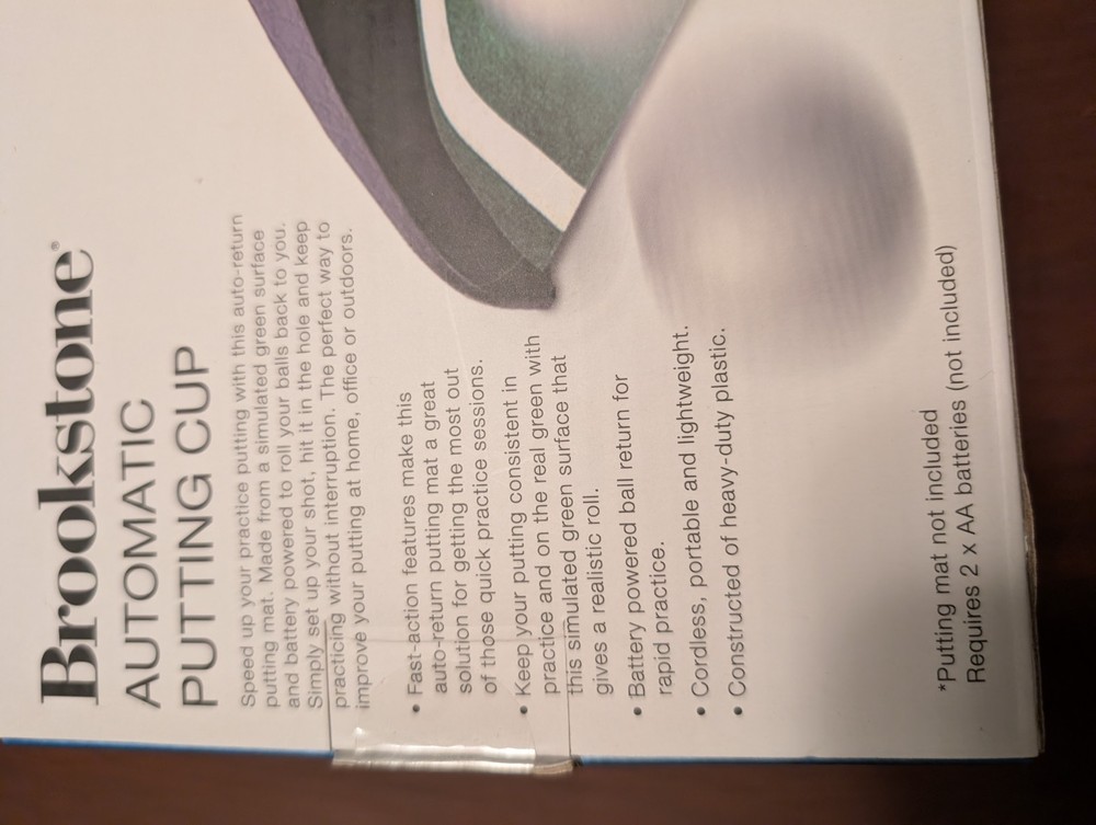 Brookstone Automatic Putting Cup Golf Putting Practice Aid Cordless Portable