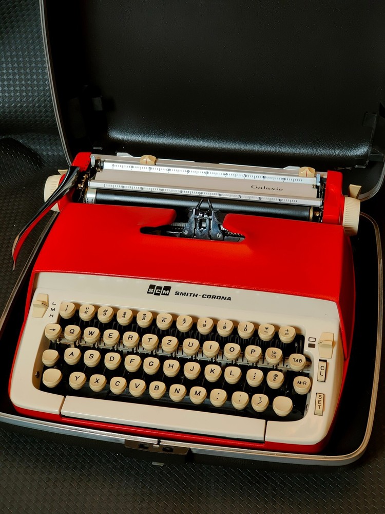 red, portable Smith Corona Galaxie typewriter with Cursive / Handwritten Script