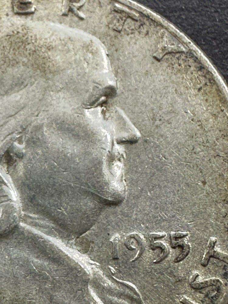 1955-P Franklin Half Dollar. Circulated. Fine. Obverse Bugs Bunny Error