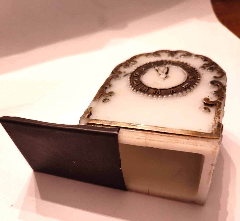CANDY CONTAINER -MILK GLASS -LOOKS LIKE CLOCK SEE ADD