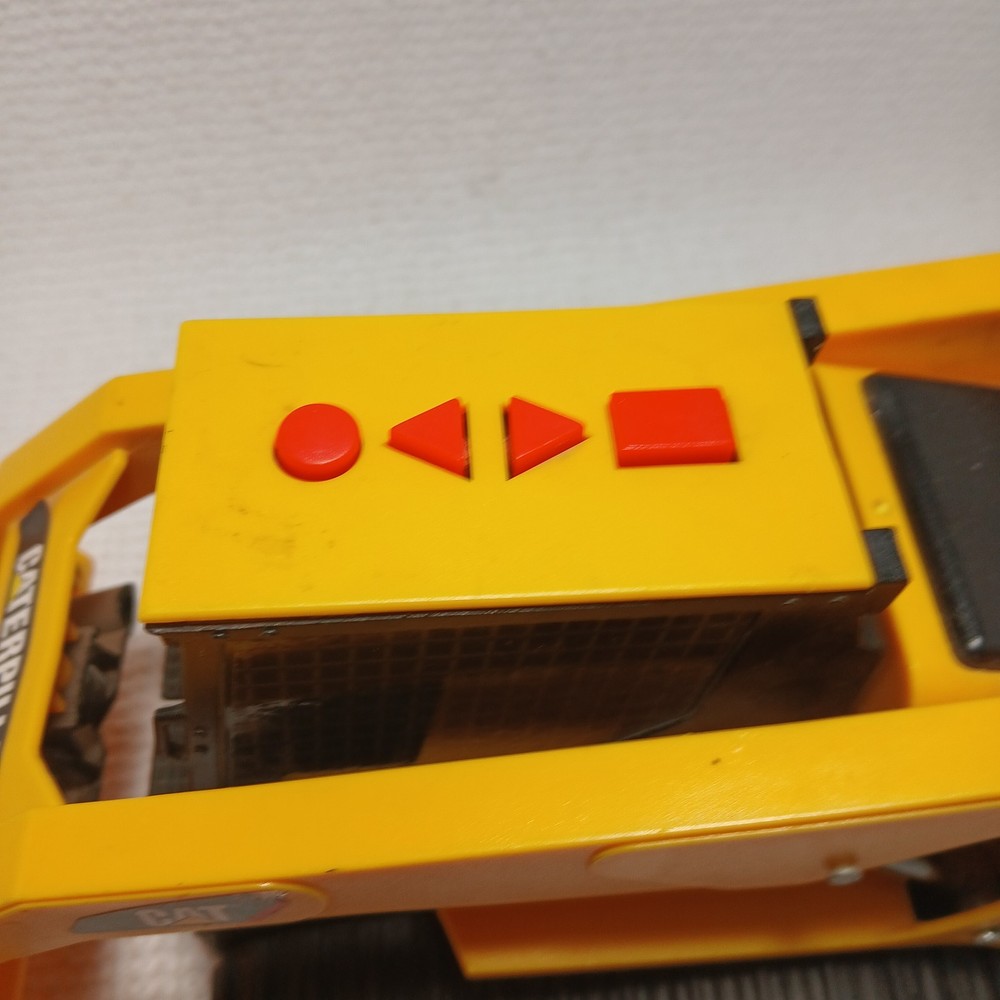 Caterpillar (CAT) toy skid steer loader, likely a "Big Builder". UNTESTED