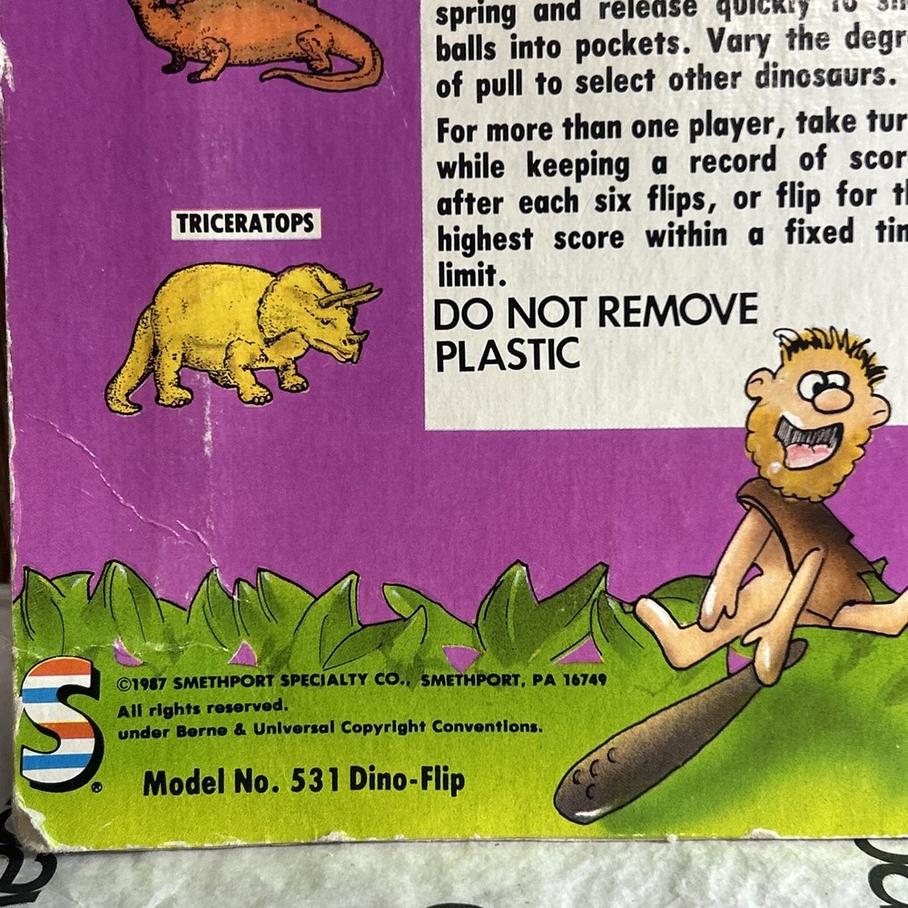 Vintage 1987 Din-o-Flip Handheld Game.