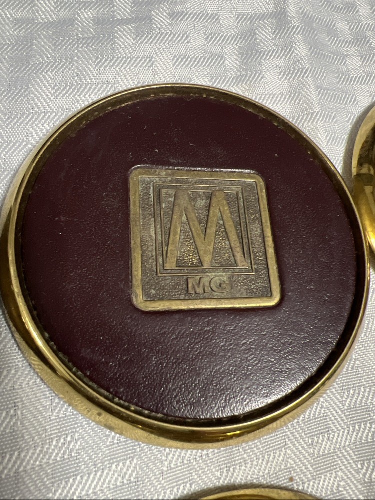 8 Vintage Solid BRASS and Brown LEATHER M MG COASTERS