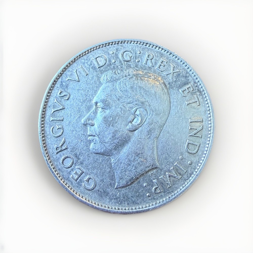 1942 Canadian half dollar - 80% silver - nice coin