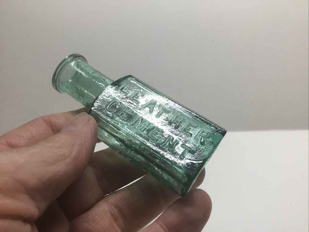 Small Antique Bigg & Co. Trademark Leather Cement Bottle.