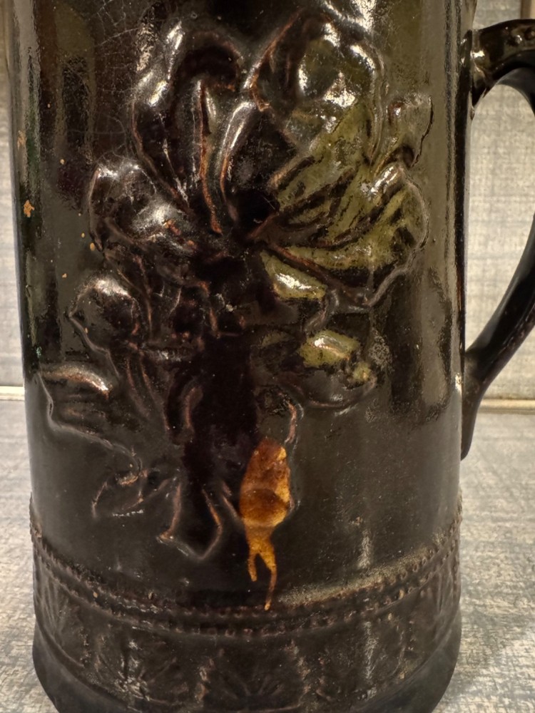 Antique Ceramic Pitcher with raised floral pattern
