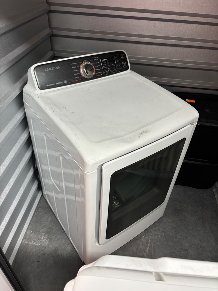 Used 2022 White High Efficiency Samsung Top Loading Washer and Dryer.