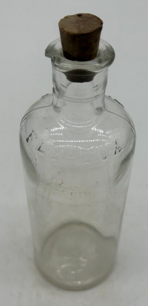 Clear small Fly Tox bottle with cork