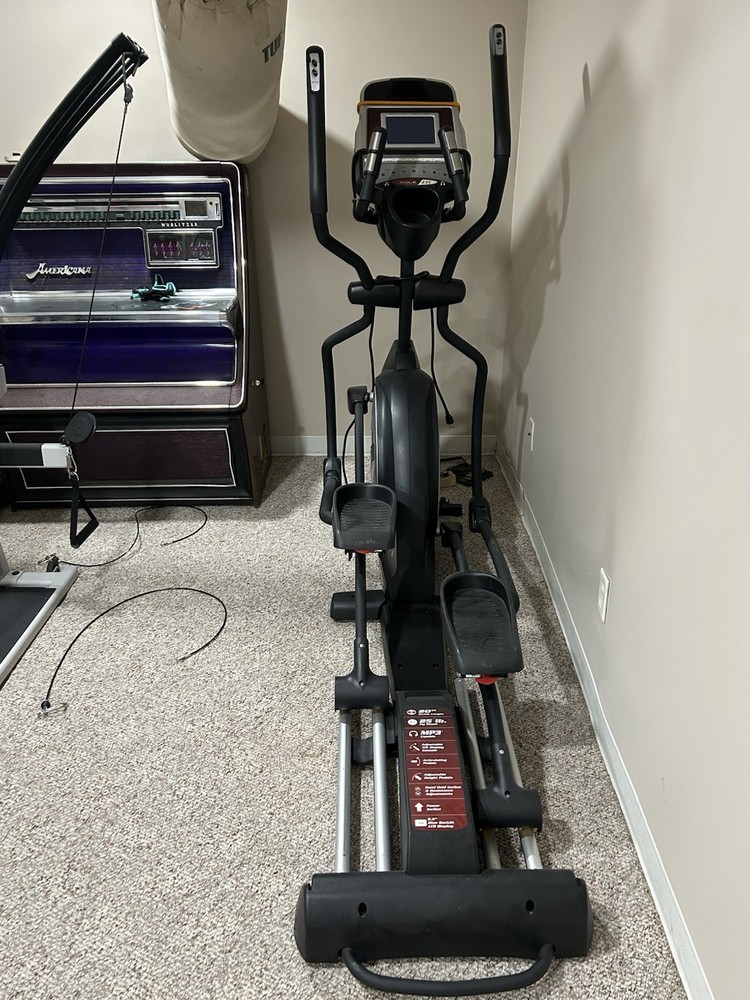 Sole E35 elliptical machine, featuring its digital display panel, dual handlebar