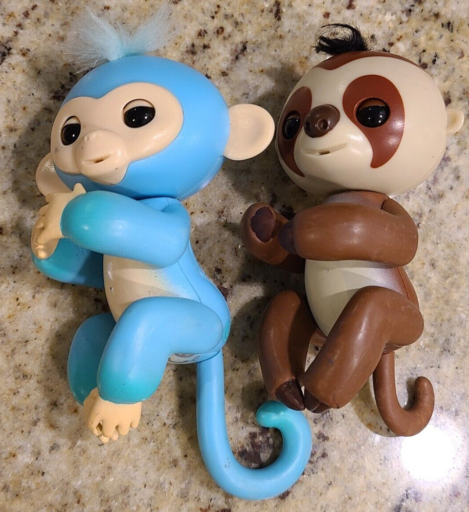 2  Fingerlings Interactive Baby Monkey Blue Brown Toys. Both work tested.