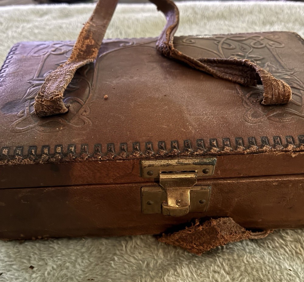 Antique leather-bound etui or traveling caddy set