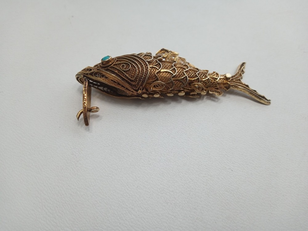 Tested as silver and gilded flexible fish, possibly pill box.