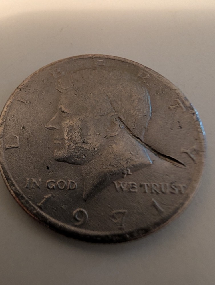 1971 Half Dollar Struck Through Wire And Error On His Cheek