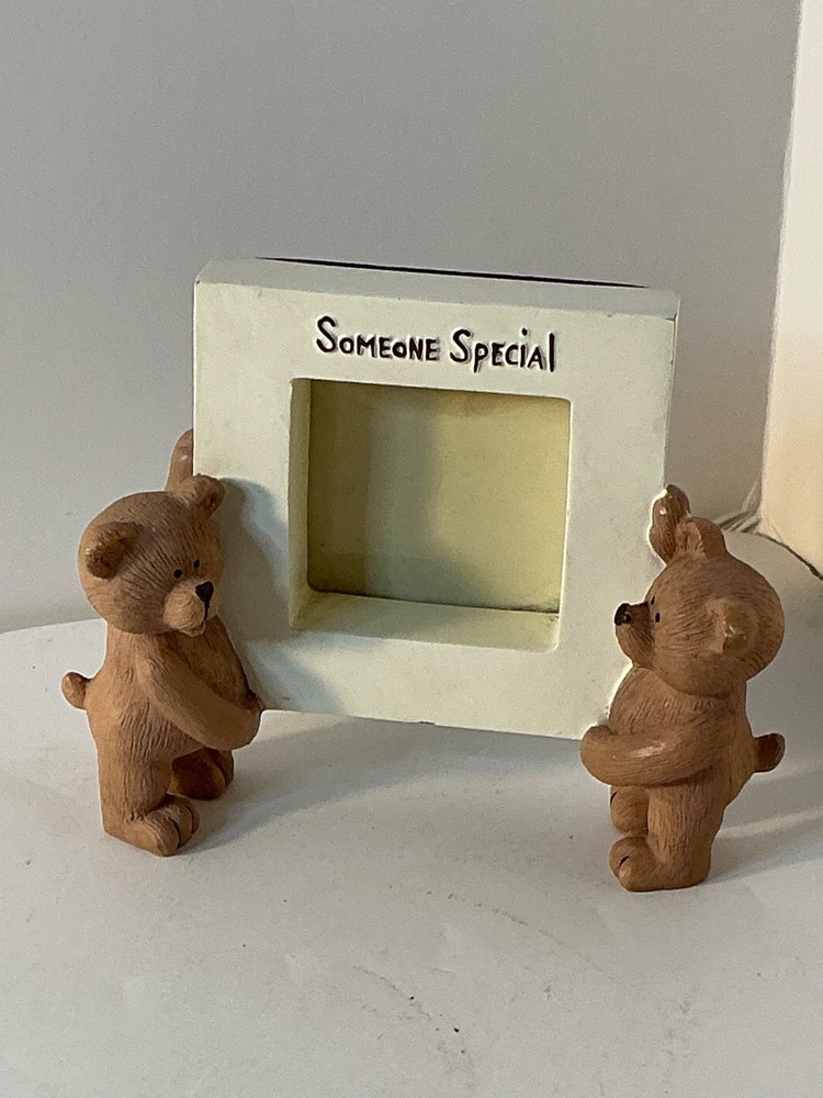 Two bears holding a picture frame "Someone special"