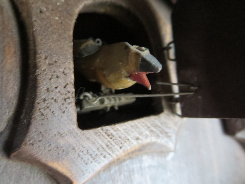 Old Cuckoo clock with articulated bird