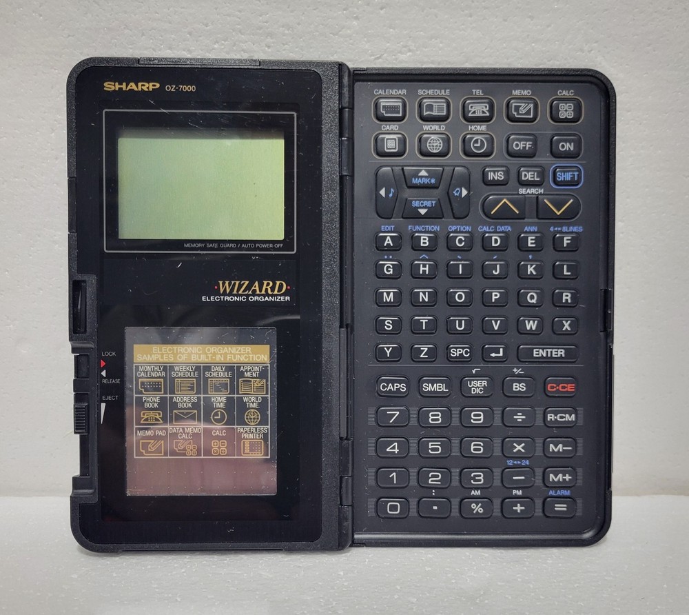 Vintage Sharp OZ-7000 WIZARD Electronic Organizer Calculator. Untested