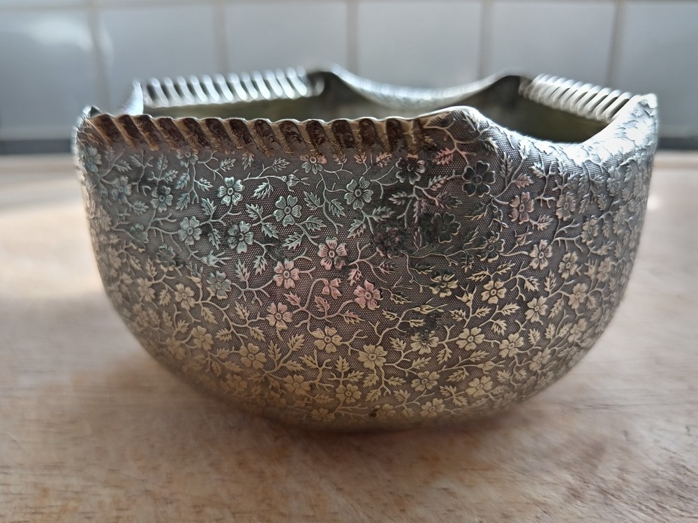 Silver plated very ornate rose bowl.