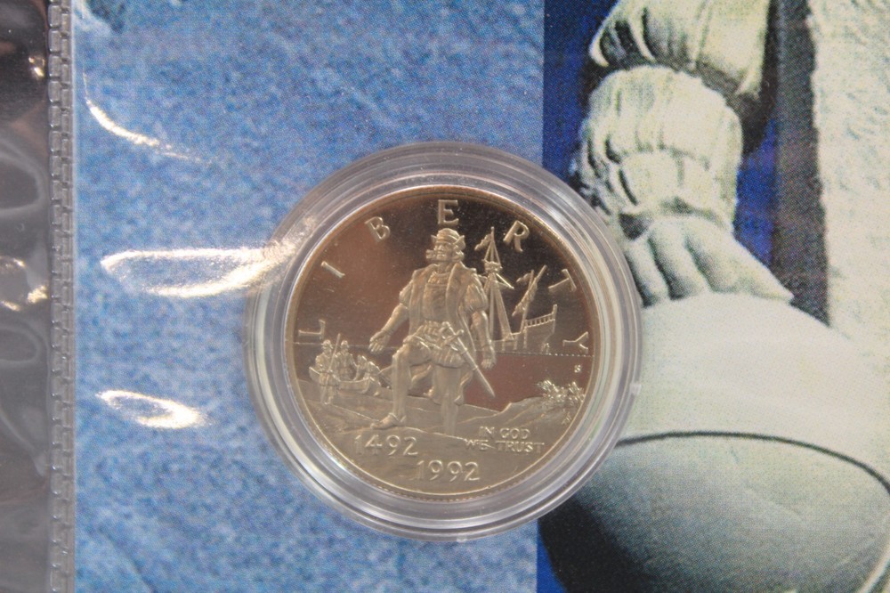 1992s Christopher Columbus Quincentenary Clad Half Dollar, set with stamp.
