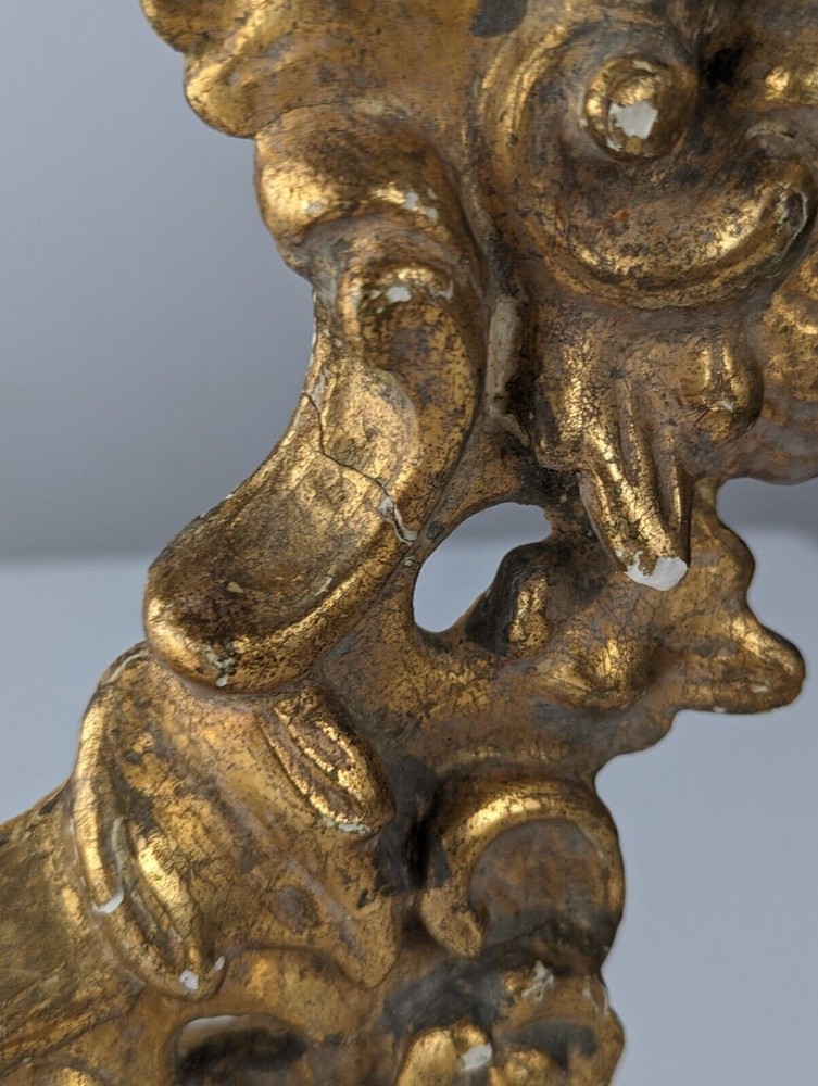 Antique gilt stuccoed wood frame