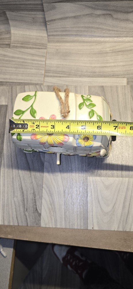decorative birdhouse styled like a vintage camper van