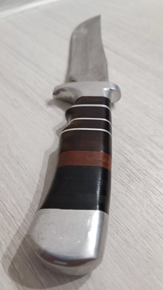 Antique handmade hunting knife with a pattern.